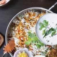 Vegetable Biryani · Long grained aromatic basmati rice cooked with vegetables with caramelized onions, fresh min...