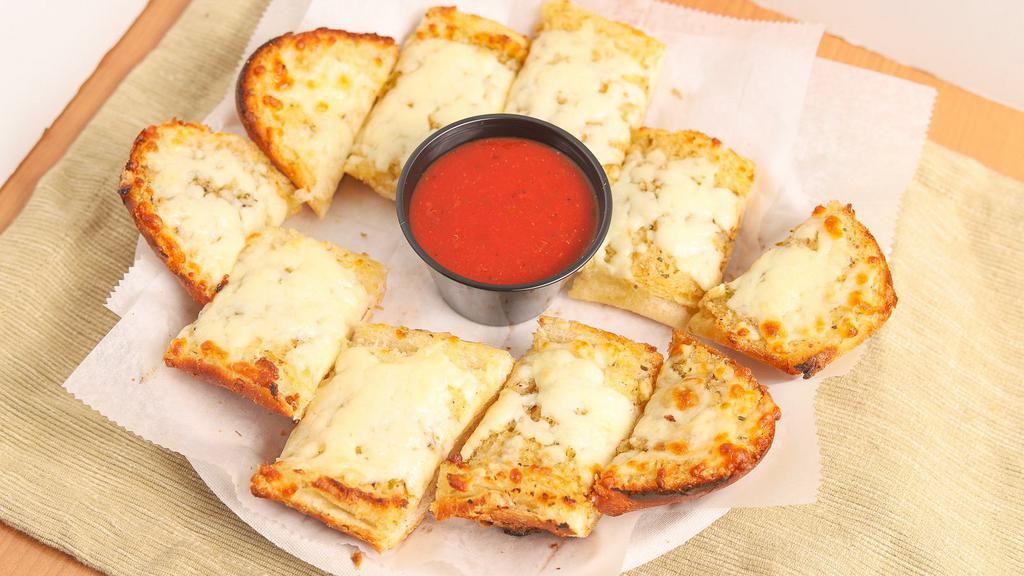 Garlic & Parm Bread Bites · Toasty garlic and parmesan cheese bites generously seasoned and served with marinara sauce on the side.
