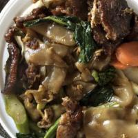 Pad See Ew · Broad rice noodles stir-fried with Chinese broccoli and egg in a brown sauce. Your choice of...
