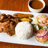 Stewed Chicken / Pollo Guisado · with rice and beans, plantains, and choice of salad or vegetables / con arroz y habichuelas,...