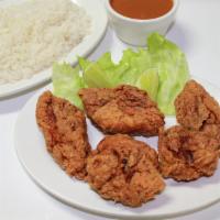 Fried Chicken Pieces / Chicharron De Pollo · with choice of rice and beans or fried plantains / con selección de arroz y habichuela o tos...
