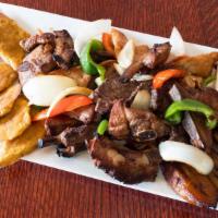 Three Meats Sampler / Tres Carnes · chicken breast, beef strips, and pork ribs with fried plantains and sweet plantains / pechug...