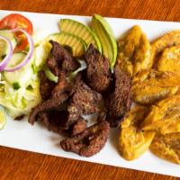 Fried Pork Strips / Carne Frita · with rice and beans, plantains, and choice of salad or vegetables / con arroz y habichuelas,...