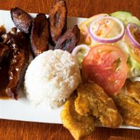Oven Baked Ribs In Bbq Sauce/ Costilla A La Bbq · with rice and beans, plantains, and choice of salad or vegetables / con arroz y habichuelas,...