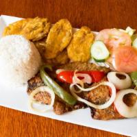 Fried Fish Fillet / Fillete De Pescado Frito · with rice and beans, plantains, and choice of salad or vegetables / con arroz y habichuelas,...