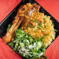 Rice And  Lamb Shank And Salad · Rice cooked with spices, served with a lamb shank.