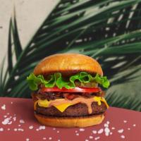 Your Vegan Burger · Seasoned Impossible burger patty topped with your favorite choice of toppings! Served on a t...