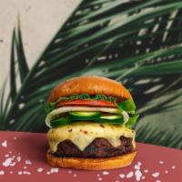 Crazy Caliente Vegan Burger · Seasoned Impossible burger patty topped with melted vegan cheese, jalapenos, lettuce, tomato...