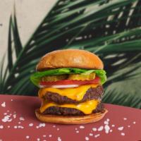 Double Slam Vegan Burger · Two seasoned Impossible patties topped with melted vegan cheese, lettuce, tomato, onion, and...