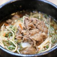 Ttukbaeki Bulgogi / 뚝배기 불고기 · Marinated beef in soup, comes with rice and kimchi.
