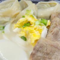 Rice Cake & Dumpling Soup In Beef Bone Broth With Rice Cake / 사골 떡만두국 · Handmade meat dumpling with rice cake in beef bone broth.
