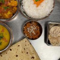 Aloo Gobi Thali (Vegan Platter) · Potato & Cauliflower Curry, Dal, Rice, Roti, Papadum & carrot halwa. Vegan.