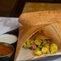 Masala Dosa (Vgf) · A crispy rice and lentil crepe filled with with spiced mashed potatoes and onions.    Served...