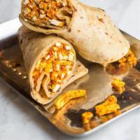 Paneer Kathi Roll · Seasoned Paneer, onions,  peppers & cilantro chutney rolled up in a homemade roti.