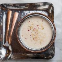 Phirini (Gf) · Traditional rice pudding flavored with almonds and cardamom. Gluten Free.