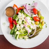 Athenian Greek Salad · with Lettuce, Tomatoes, Onions, Cucumbers, Green Peppers, Black Olives, Feta Cheese & Stuffe...
