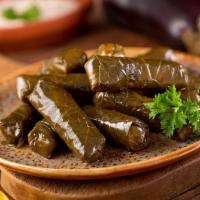 Stuffed Grape Leaves (5 Pc) · Fresh vine grape leaves stuffed with rice drizzled in olive oil & herbs. Not served with Pita