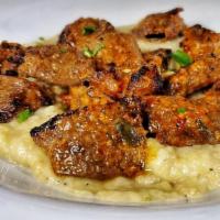 Ck Hunkar Begendi · Chicken shish served over creamy mozzarella cheese and smoked eggplant puree with choice of ...