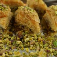 Pistachio Baklava (1 Pc) · Layered pastry dessert made of filo pastry, filled with chopped nuts, and sweetened with hon...