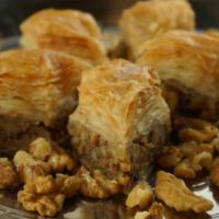 Walnut Baklava (4Pc) · Layered pastry dessert made of filo pastry, filled with chopped walnuts and sweetened with h...