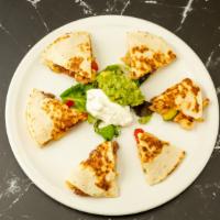 Quesadilla · Gluten-free.  Grilled fresh flour or whole wheat tortillas (your choice) stuffed with cheese...
