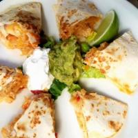 Double Decker Quesadilla W/ Seafood · Grilled fresh flour tortillas stuffed with low fat cheese in two layers with seasonal seafoo...