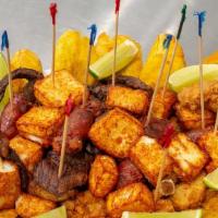 Picaderas Mixta
 · Fried Beef, Chicken, Pork, and Cheese with tostones. / Carne Frita, Pollo, Cerdo y Queso con...