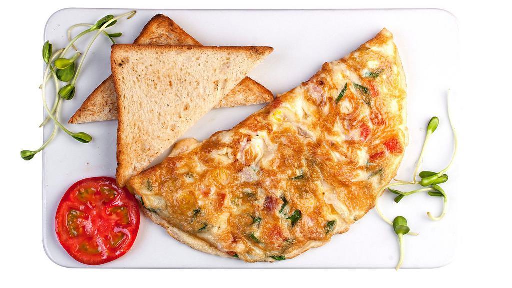 Mexican Omelet · Fluffy, buttery three egg omelet with soft, fresh mozzarella cheese, jalapeños and fried potatoes, made to order.