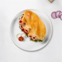 Honey Glazed Turkey Sandwich · Honey glazed turkey with cheese, lettuce, and tomato. Served on your choice of bread.