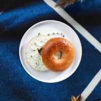 Scallion Scene Bagel · Toasted bagel topped with scallion cream cheese.