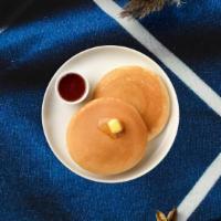 Triple Threat Pancakes · (Three pieces) Fluffy pancakes cooked with care and love served with butter and maple syrup.