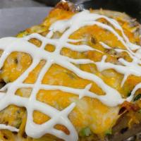 Loaded Baked Potato · Monterrey and cheddar cheese blend, bacon, beans, caramelized onions, chopped broccoli, sour...