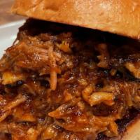 Bbq Pulled Pork Sandwich · Housemade pulled pork blended with Sweet Baby Ray's BBQ sauce served on a toasted brioche bu...