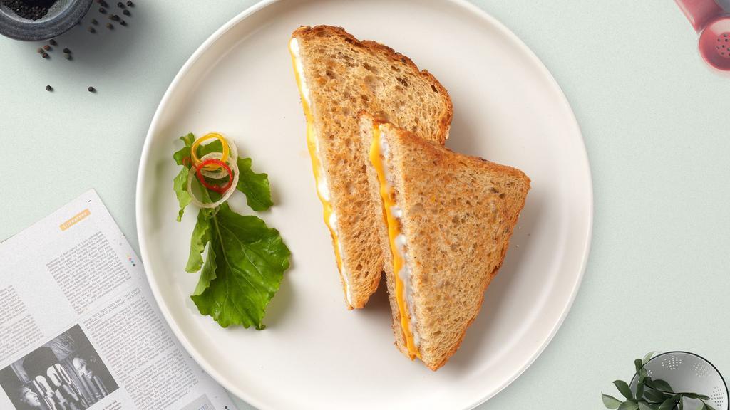 Classic Grilled Cheese · Melted American cheese served on a grilled sliced bread.