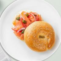Salmon Season Bagel · Smoked salmon, avocado, onions, tomato, capers, and fresh dill served on a bagel.