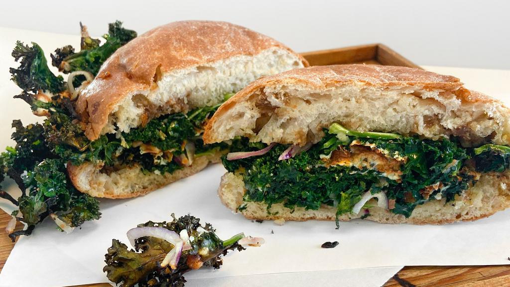 Kale Salad Sandwich · We took your favorite salad and made it a sandwich. Kale salad, mozzarella, balsamic vinegar, on ciabatta - toasted up in the oven. Add salami, an egg, roasted tomatoes or anchovy. No substitutions please, omissions ok.