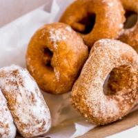 Housemade Cake Donuts (12) · Choose plain, cinnamon sugar, or powdered sugar.