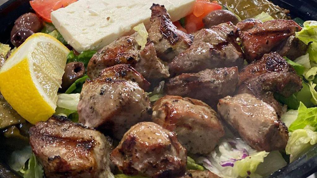 Bifteki Platter · With Greek salad and rice.