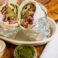 Falafel Pita Wrap · 3 Baked Falafel Balls in a Pita Wrap Topped with Cilantro, Pickled onion, Radish, and Your C...