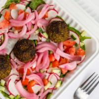 Falafel Salad · 3 Falafel Balls served on a bed of baby spinach with cucumber, radish, tomato, pickled onion...
