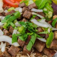 Gyro Platter · grilled lamb shawarma or gyro served with rice, salad,slice of pita bread, chickpeas, sauce ...
