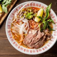 Spicy Juicy Beef Pho Noodle Soup · Choice of beef, served with spicy beef broth soup, onions, scallions, and lemon, basil and b...