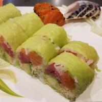 Tiger Roll · Tuna, salmon, yellowtail, avocado and crunch wrapped with soybean paper.