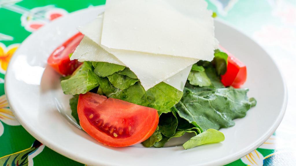 Arugula With Tomatoes And Parmigiano
 · Served with olive oil and balsamic vinegar.