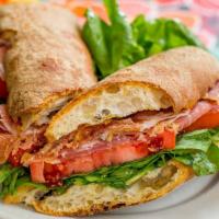 Proscuitto Di Parma Sandwich
 · With ripe tomatoes, arugula and extra virgin olive oil.