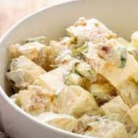 Potato Salad · Potatoes, celery, carrots, and hard boiled eggs tossed in a creamy mayo dressing.
