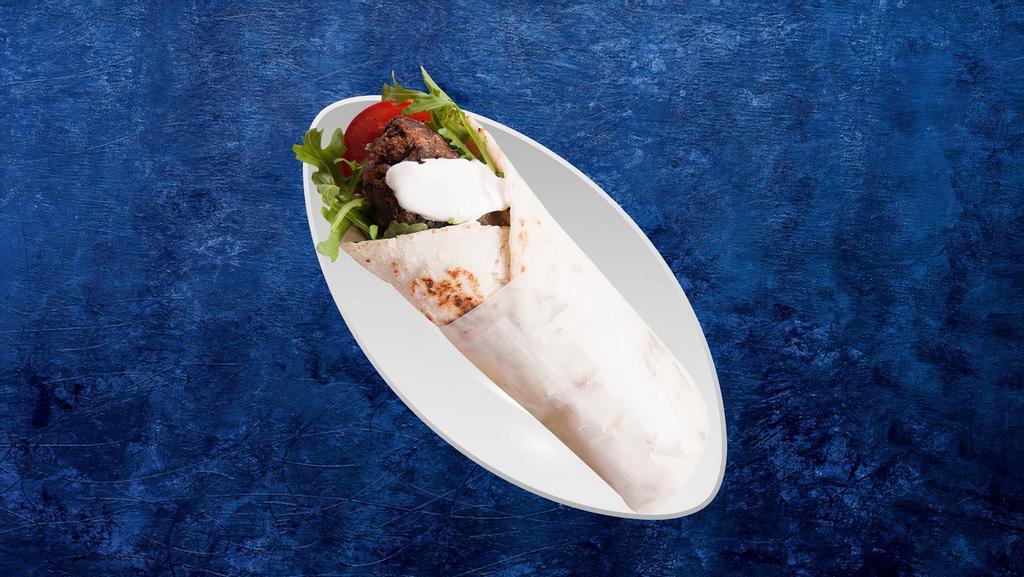 Kefta Gyro Wrap · Pita wrap filled with grilled lamb, diced onions, tomatoes, parsley, hummus and pickles,.