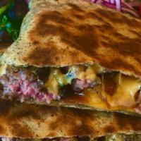 Bacon Cheeseburger Crêpe · Bite size pcs of 100% certified usda black angus beef, cheddar cheese, 
caramelized onions, ...