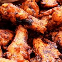 Wings · Options: breaded, fried or barbecued served with French fries.