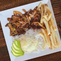 Churrasco Ecuatoriano · Ecuadorian Barbecued Steak. Served with rice, a fried egg, avocado slices and topped with Fr...